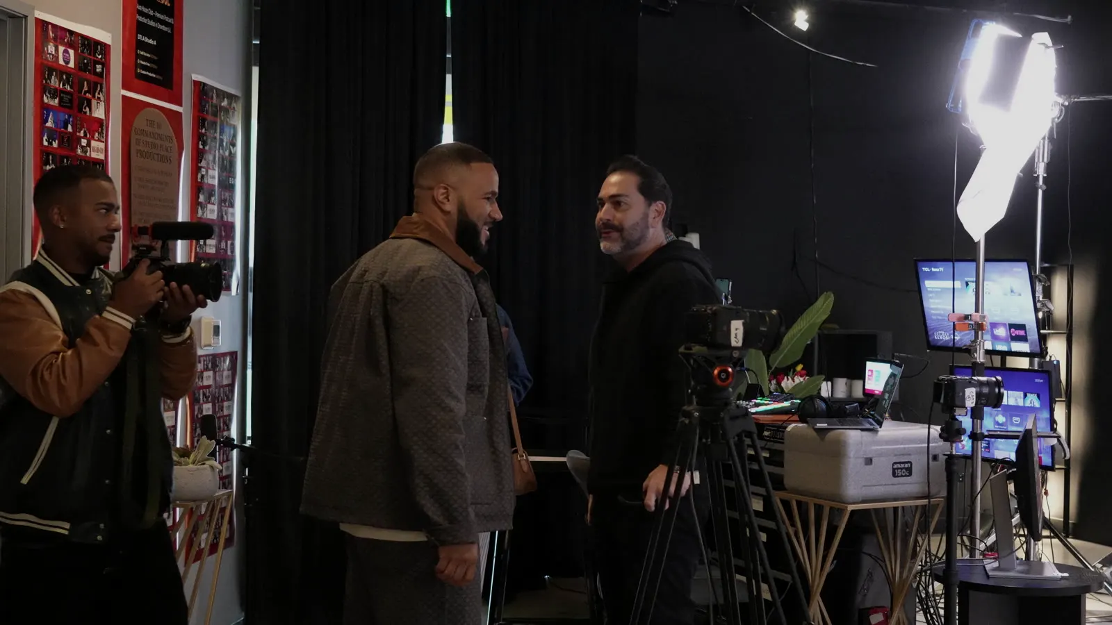 Makan Mostafavi greeting a guest on the studio set